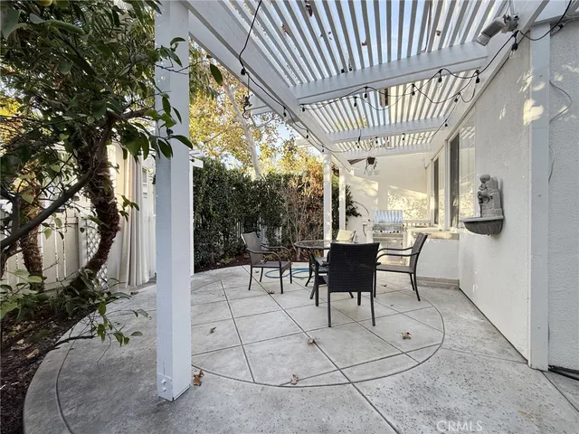 a view of a patio with table and chairs