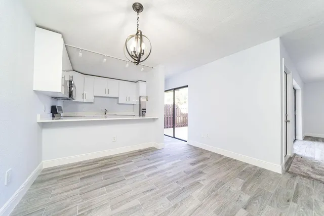 a view of kitchen with wooden floor