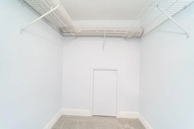 a view of a balcony with wooden floor