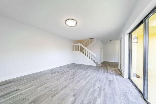 a view of entryway with wooden floor