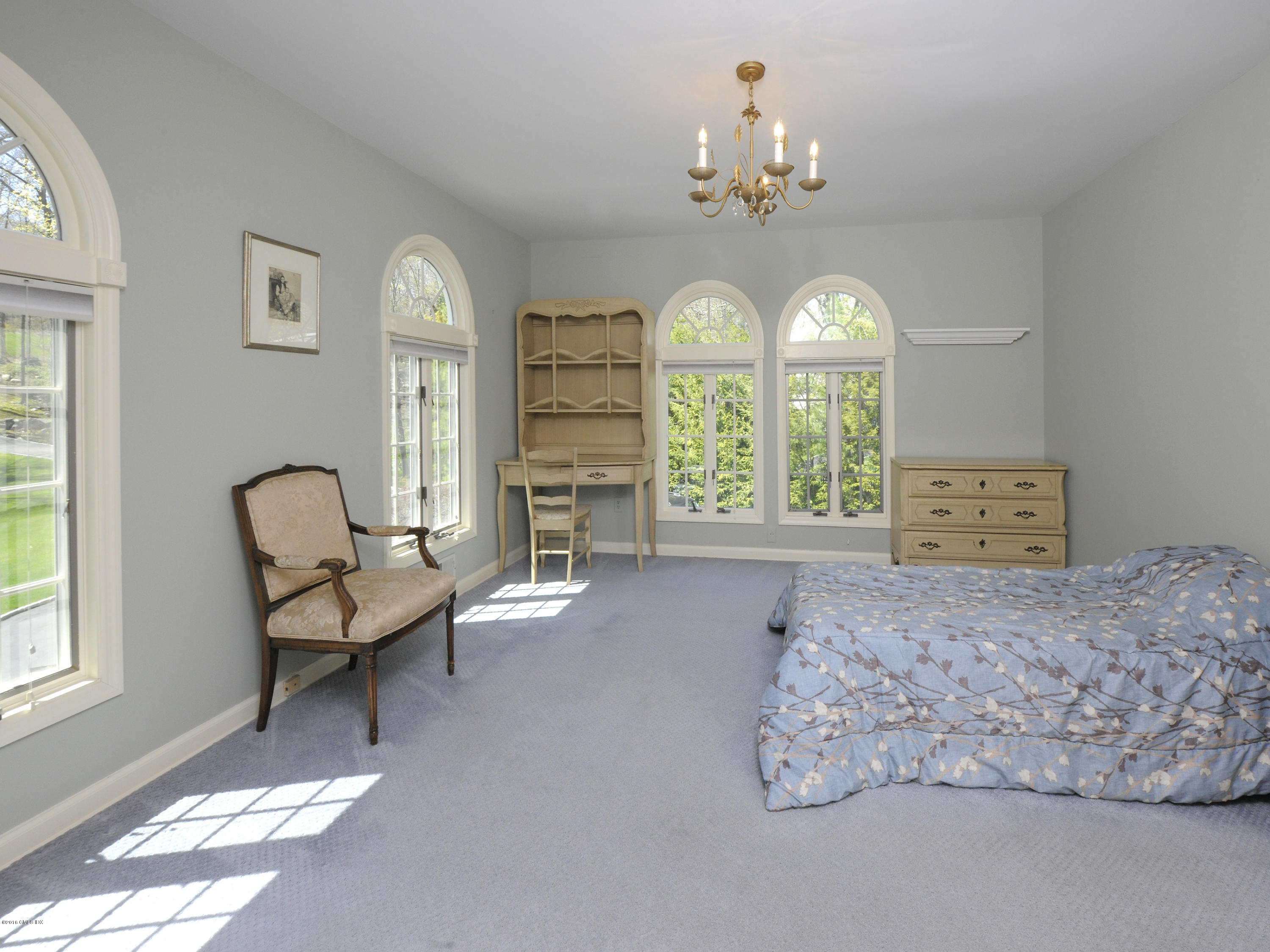 67 Burning Tree Road Greenwich, CT 06830 - Photo 15 of 28 a living room with furniture and a large window