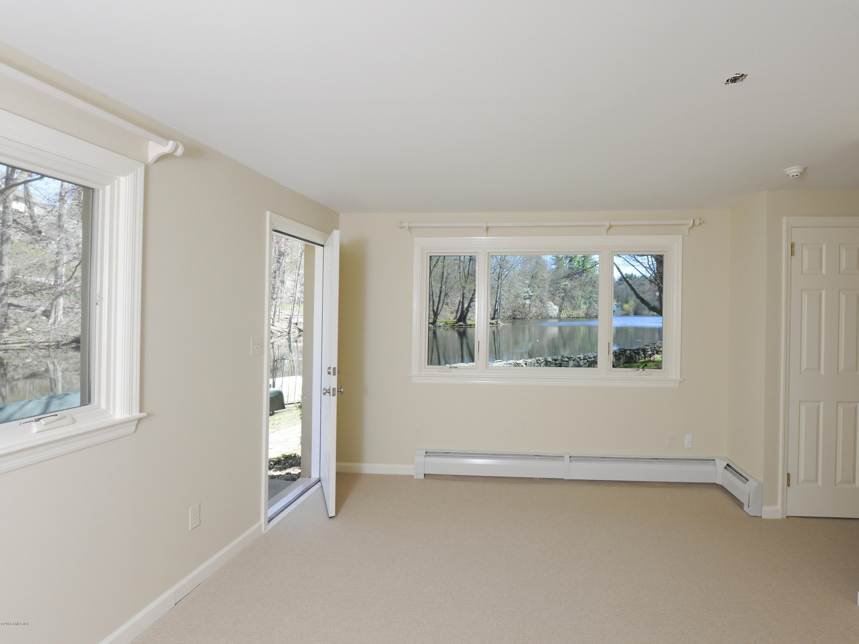 67 Burning Tree Road Greenwich, CT 06830 - Photo 18 of 28 an empty room with a window