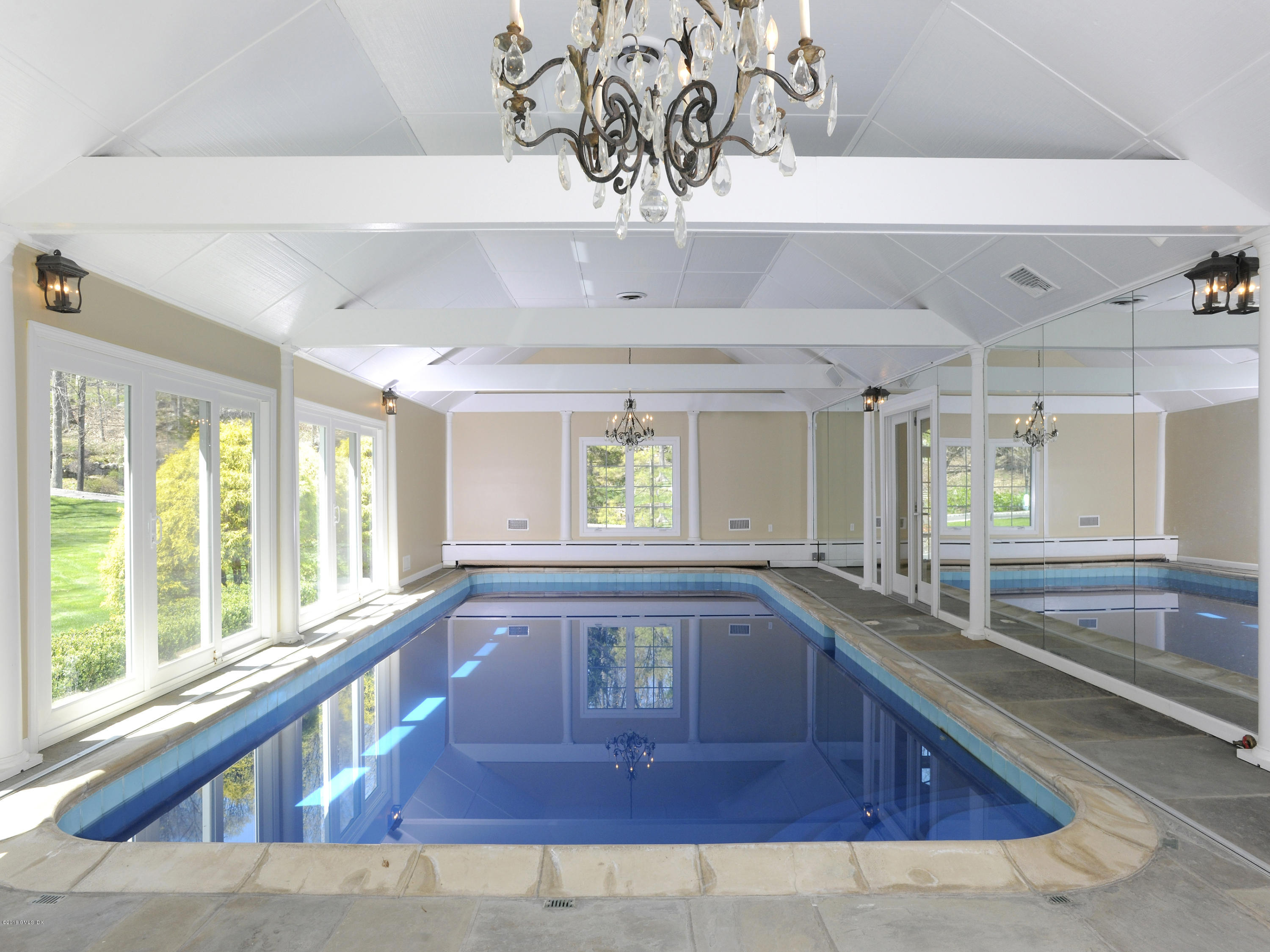 67 Burning Tree Road Greenwich, CT 06830 - Photo 23 of 28 a large white kitchen with a large window