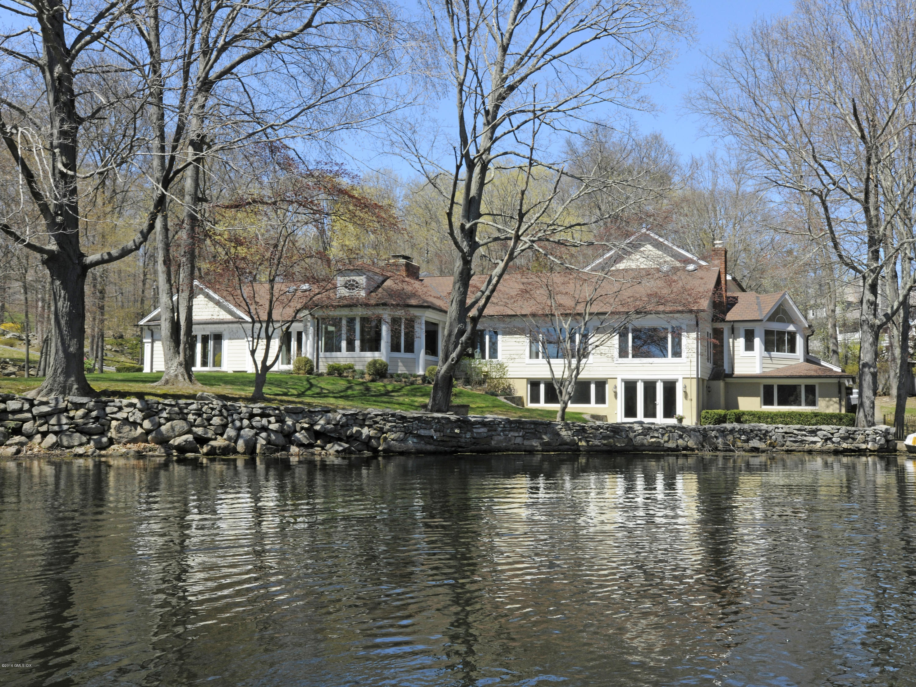 67 Burning Tree Road Greenwich, CT 06830 - Photo 25 of 28 a view of residential houses with yard and lake view