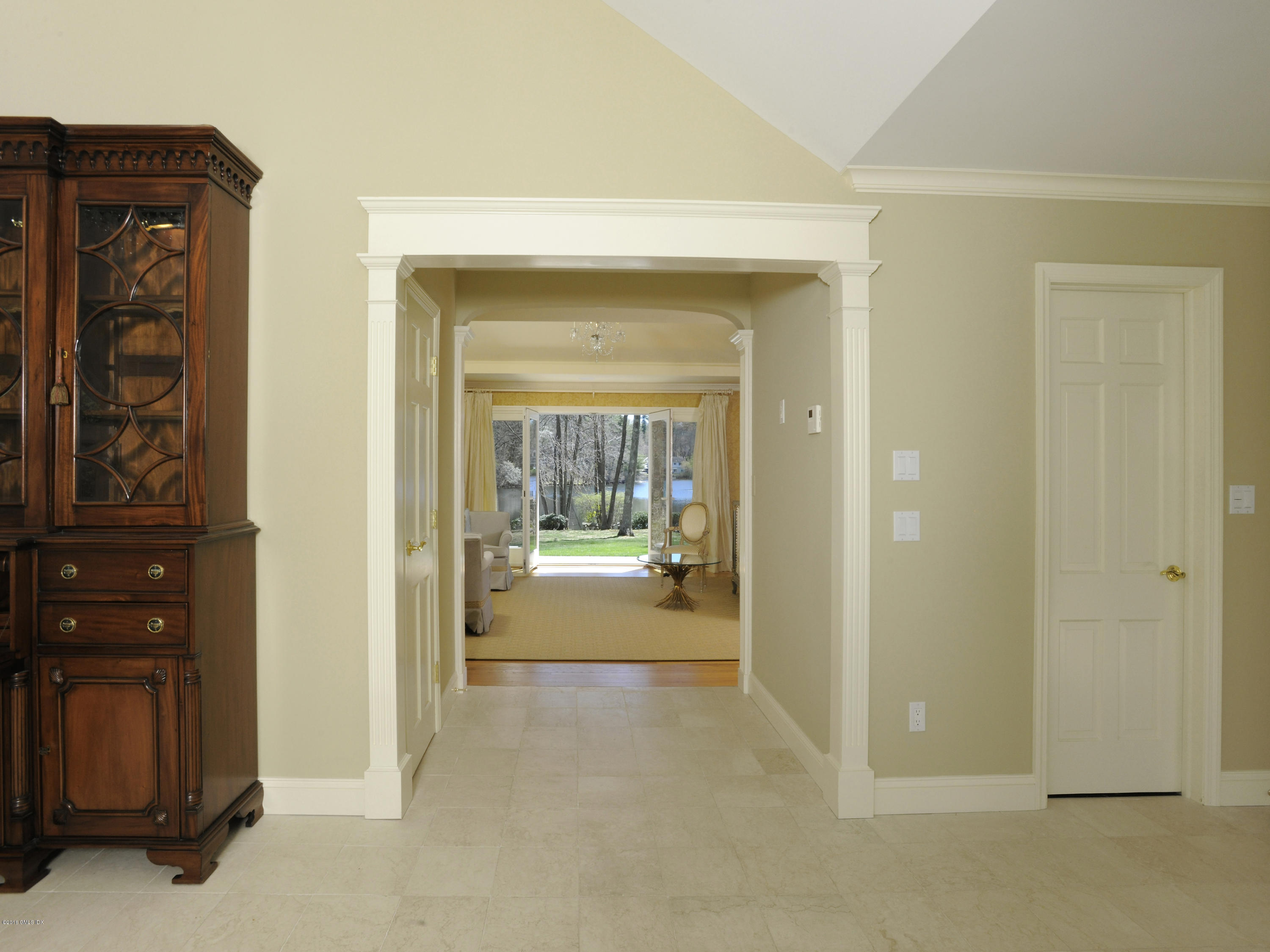 67 Burning Tree Road Greenwich, CT 06830 - Photo 6 of 28 a view of a hallway view with wooden floor and furniture