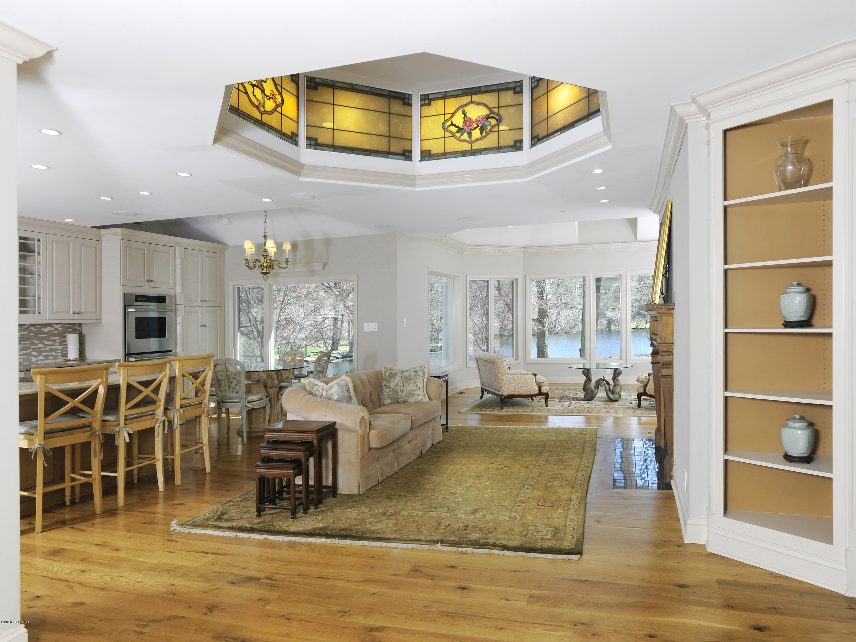 67 Burning Tree Road Greenwich, CT 06830 - Photo 9 of 28 a living room with furniture and a table