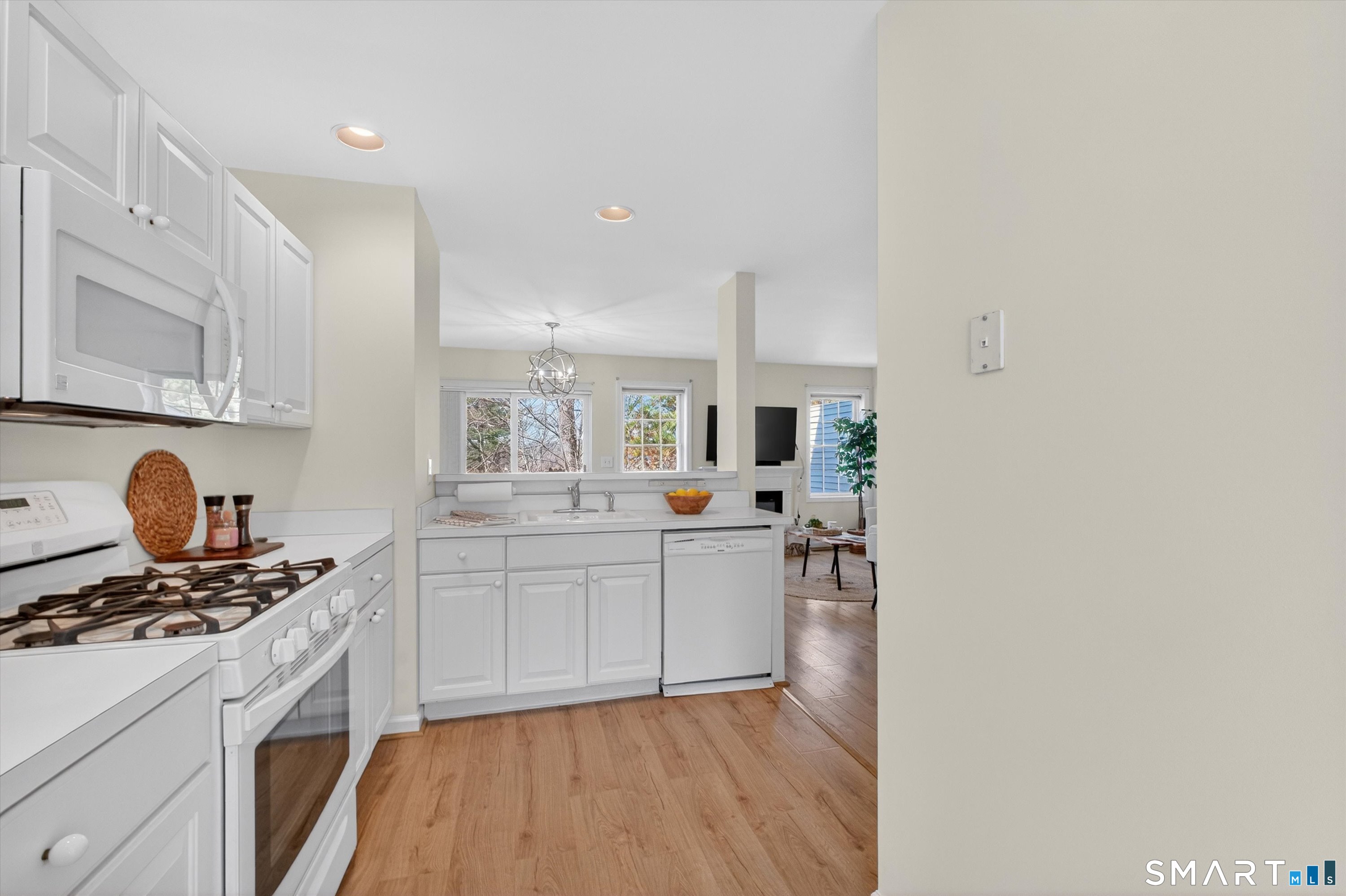 1502 Pinnacle Way, Unit 1502 Danbury, CT 06811 - Photo 29 of 45 a kitchen with stainless steel appliances granite countertop a stove and a sink