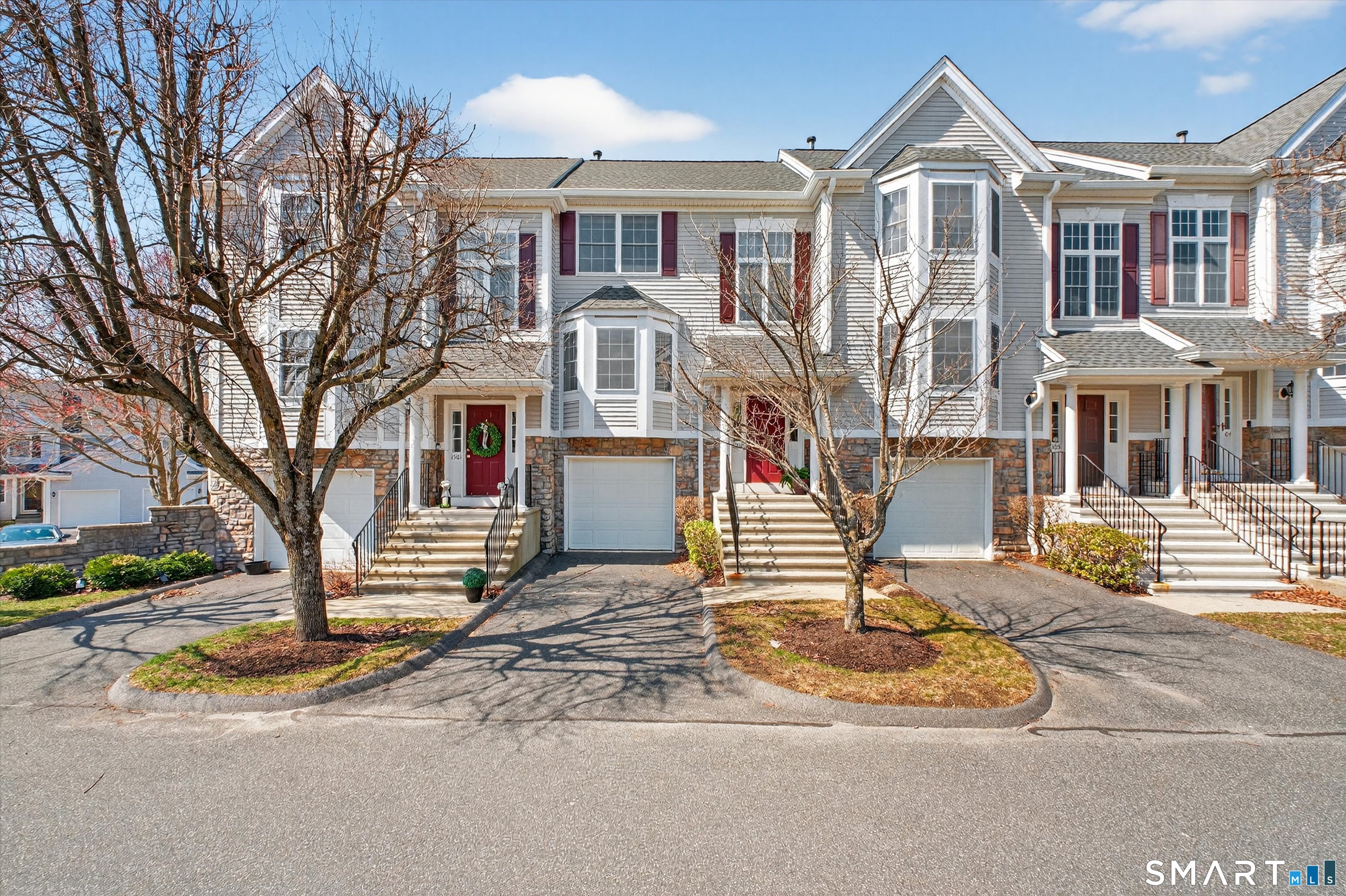 1502 Pinnacle Way, Unit 1502 Danbury, CT 06811 - Photo 5 of 45 a front view of a house with a yard