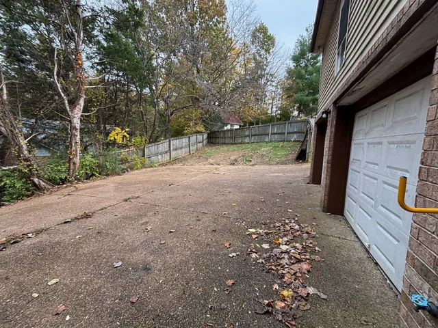 a view of backyard with green space