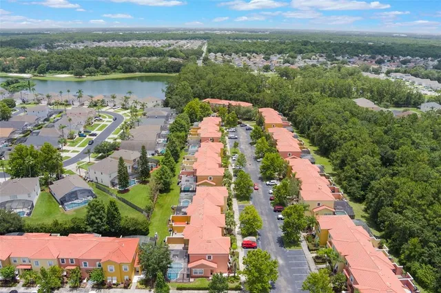 an aerial view of lake residential house with outdoor space and seating