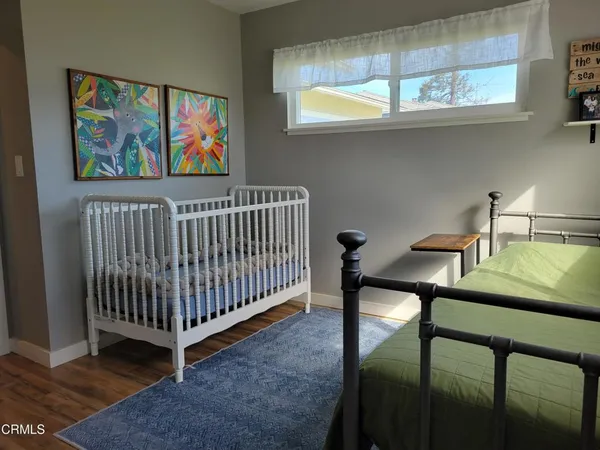 a bed room with a bed and a book shelf
