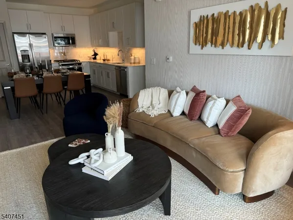a living room with furniture flowerpot and a window