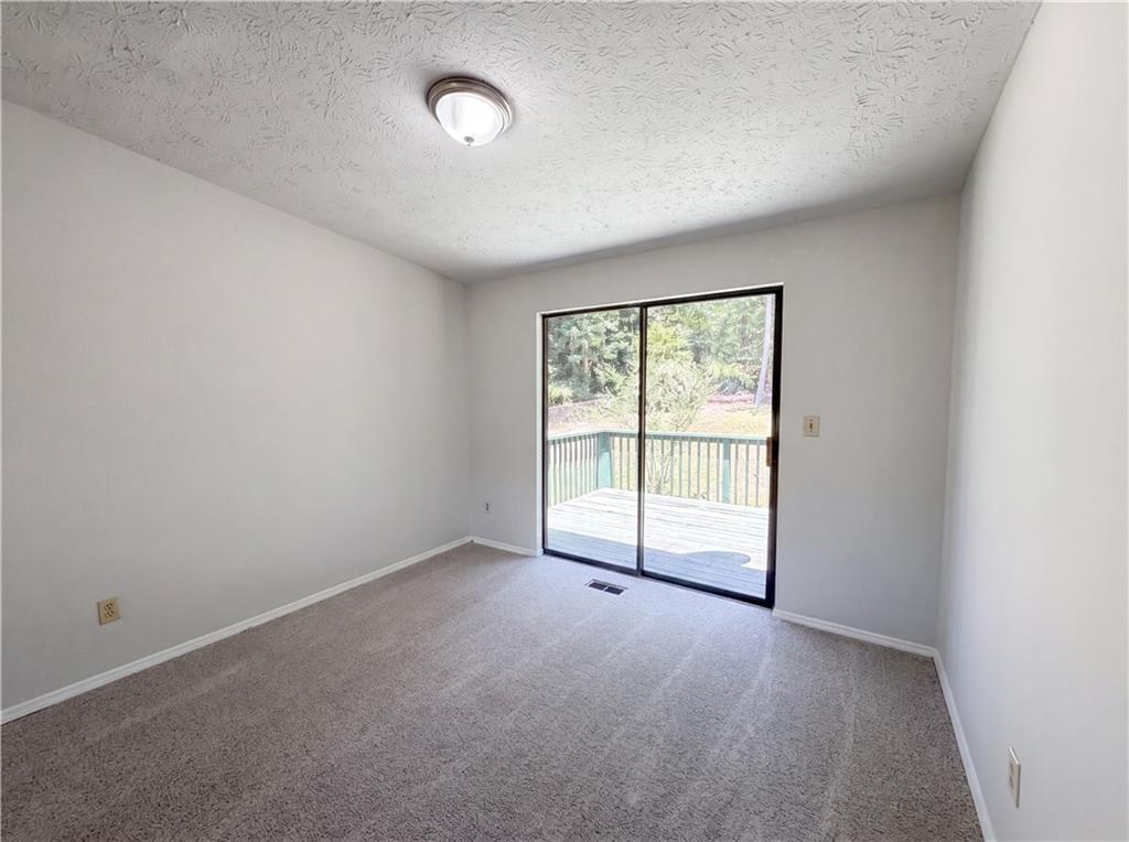 6830 Earlhurst Road Atlanta, GA 30349 - Photo 19 of 27 an empty room with a window