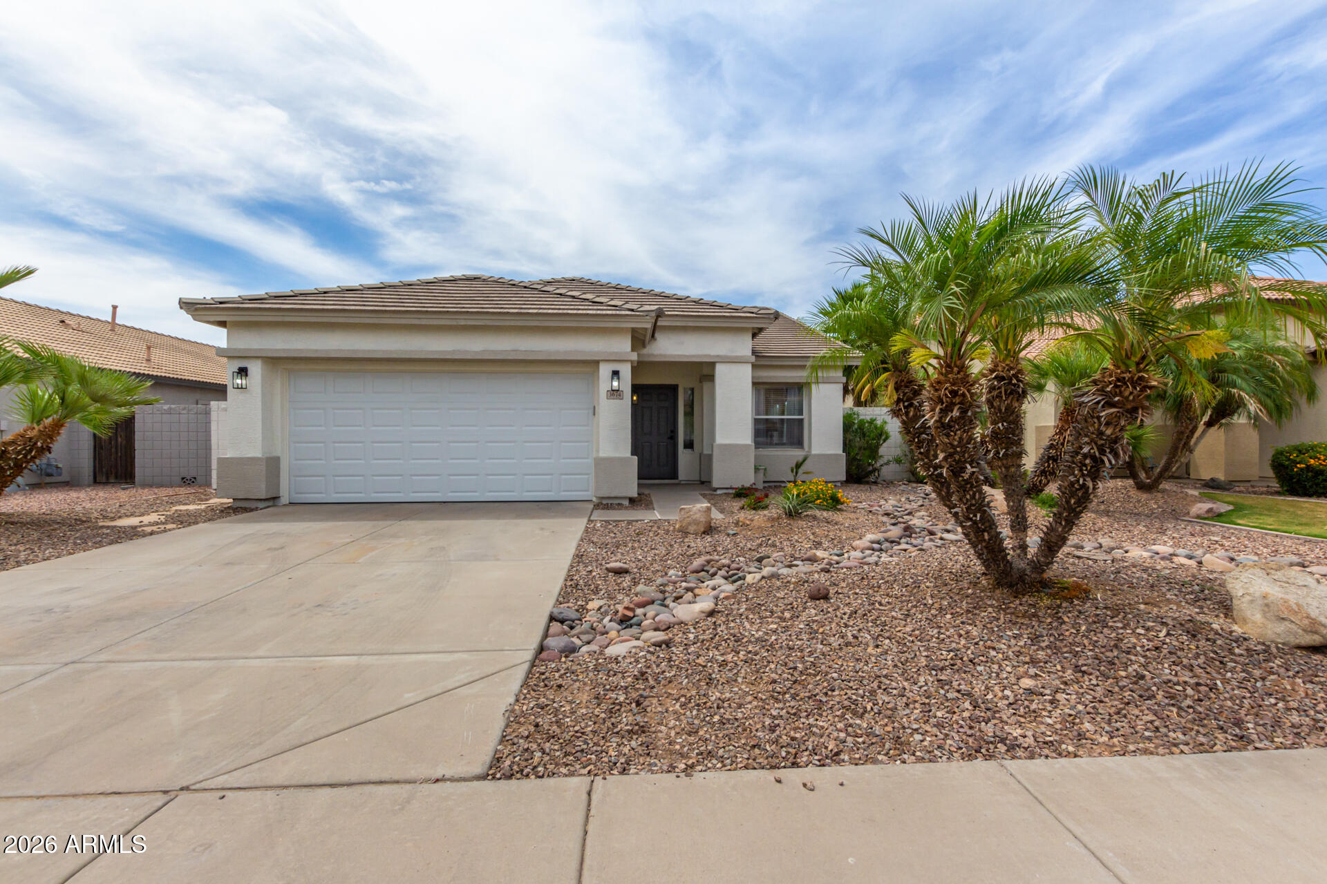 3674 South Joshua Tree Lane Gilbert, AZ 85297 - Photo 2 of 30 a front view of a house with garden