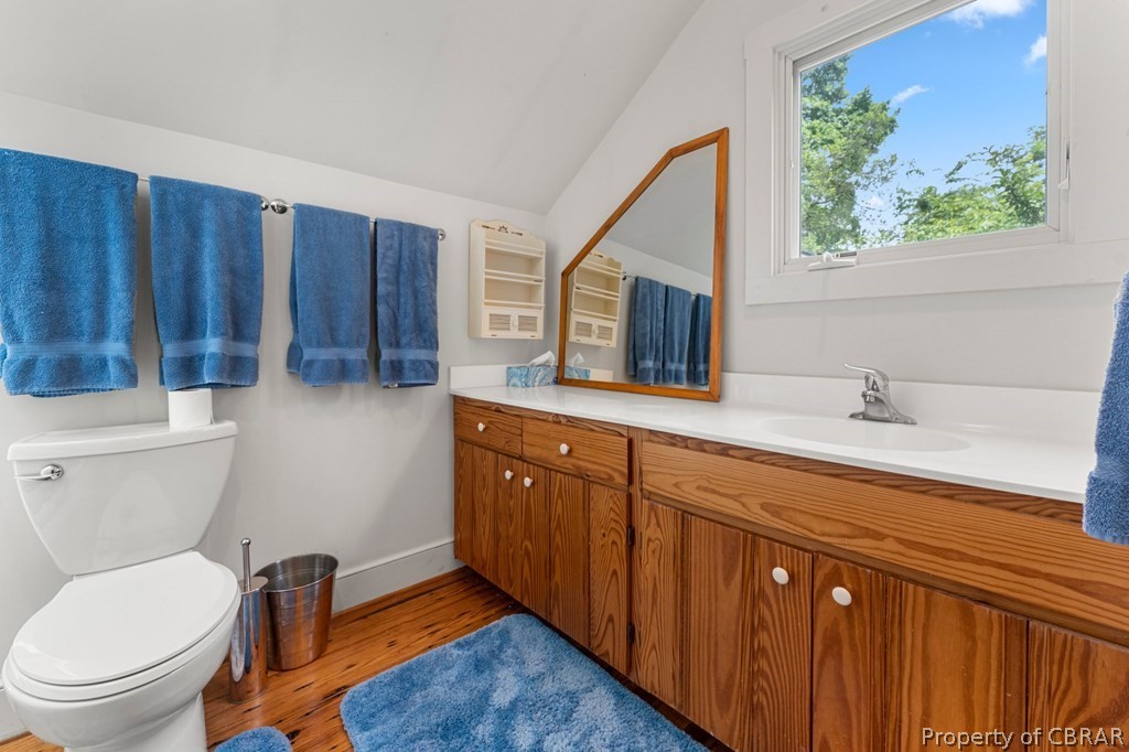 1 Cabin Road Lottsburg, VA 22511 - Photo 44 of 50 Bathroom with wood-type flooring, vaulted ceiling, toilet, and vanity