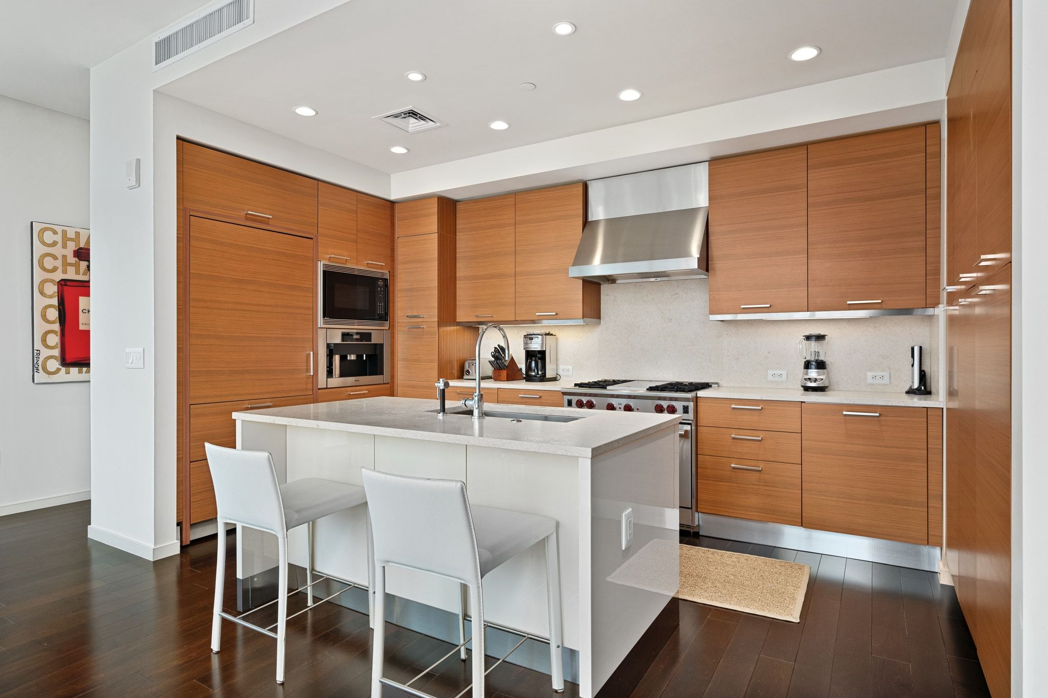 200 Congress Avenue, Unit 24E Austin, TX 78701 - Photo 11 of 40 a kitchen with stainless steel appliances granite countertop a stove a sink dishwasher and a refrigerator
