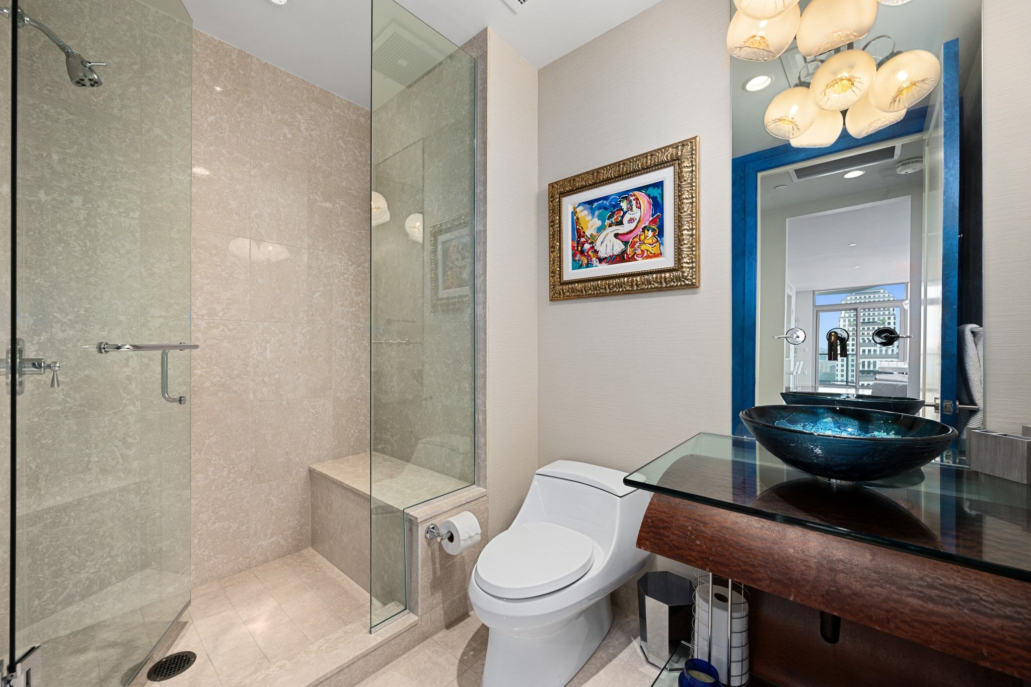 200 Congress Avenue, Unit 24E Austin, TX 78701 - Photo 23 of 40 a bathroom with a toilet a sink and shower