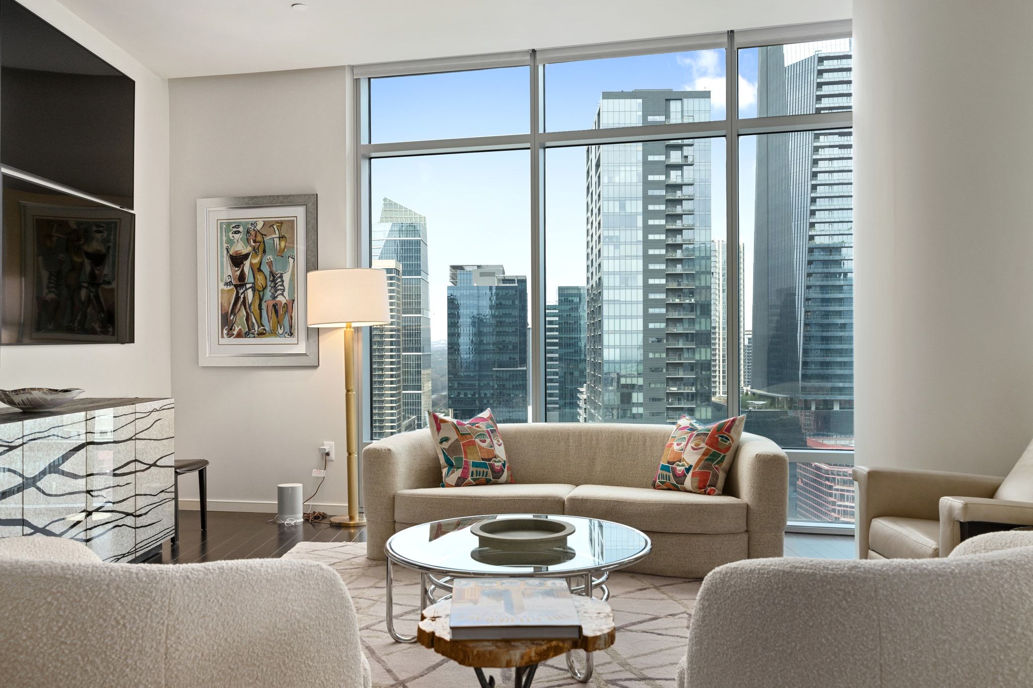 200 Congress Avenue, Unit 24E Austin, TX 78701 - Photo 6 of 40 a living room with furniture and a window