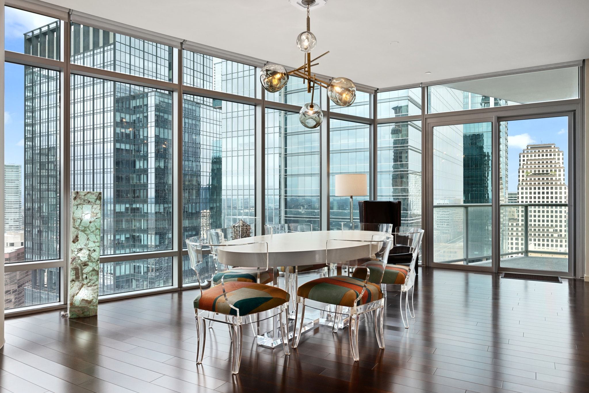 200 Congress Avenue, Unit 24E Austin, TX 78701 - Photo 7 of 40 a dining room with furniture window wooden floor