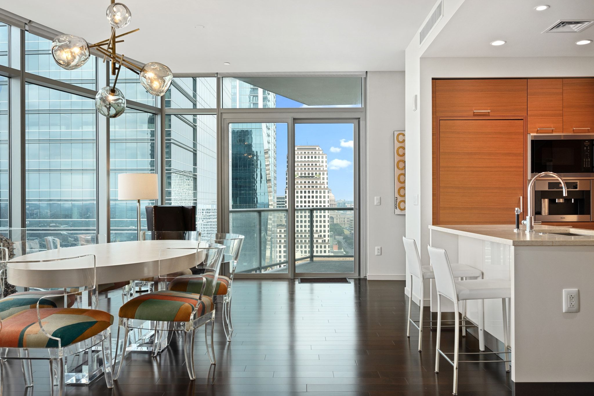 200 Congress Avenue, Unit 24E Austin, TX 78701 - Photo 8 of 40 a view of a dining room with furniture window and outside view