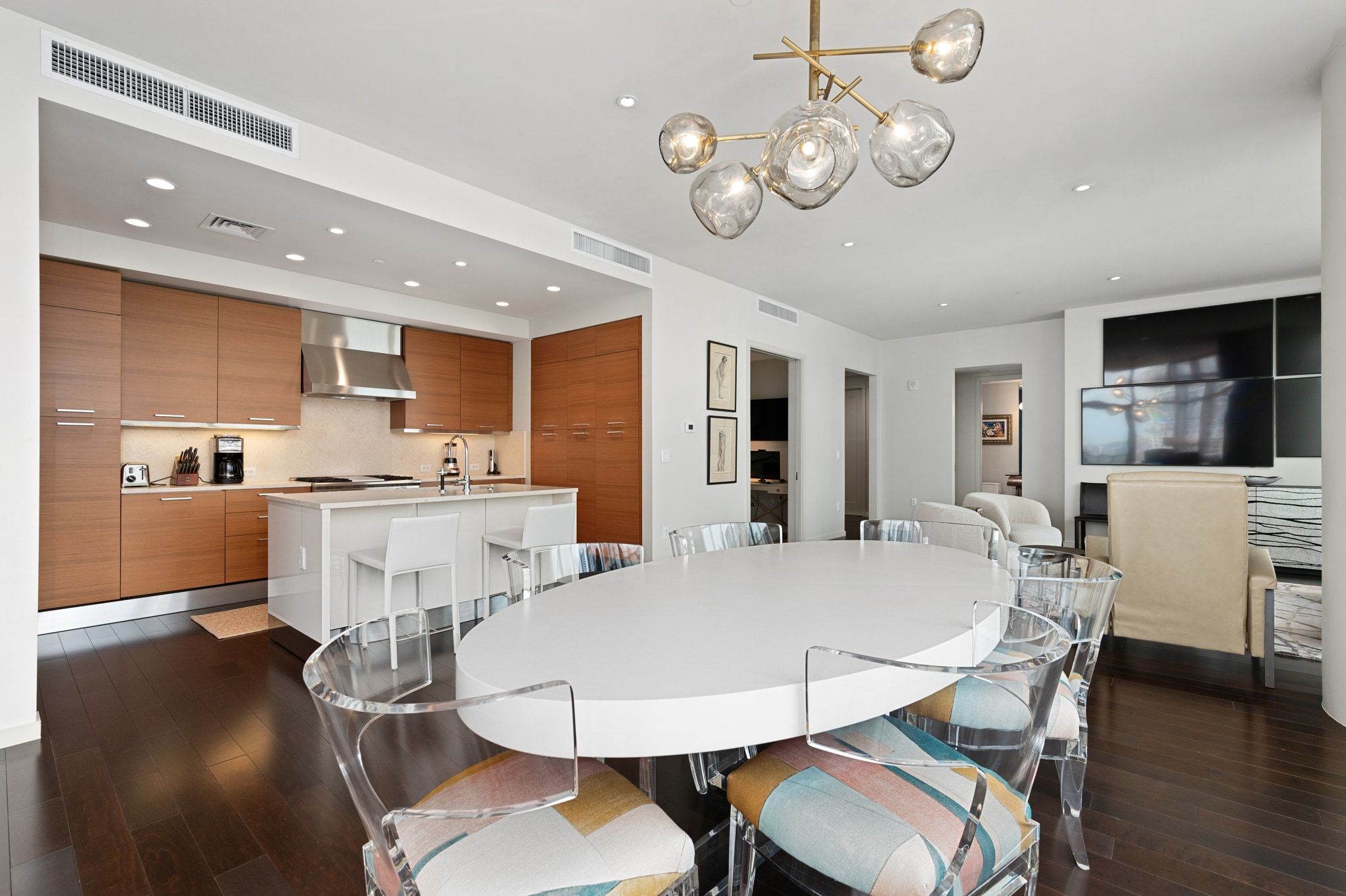 200 Congress Avenue, Unit 24E Austin, TX 78701 - Photo 10 of 40 a view of kitchen with dining table and chairs