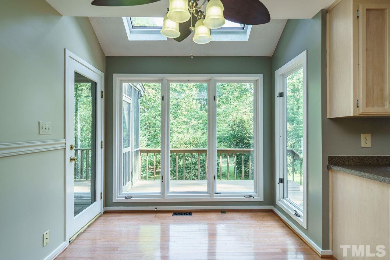 12213 Galway Drive Raleigh, NC 27613 - Photo 16 of 31 a view of room with window and hardwood floor