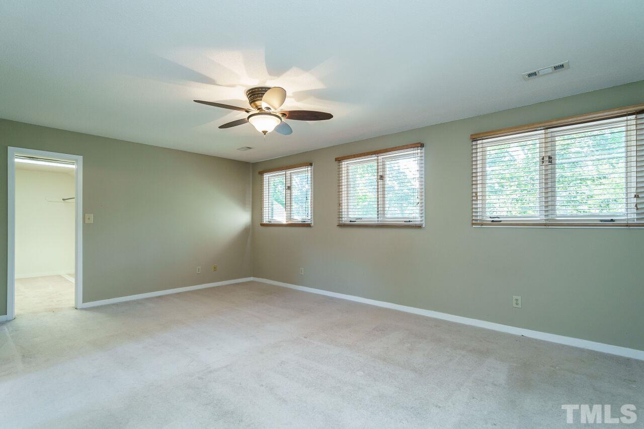 12213 Galway Drive Raleigh, NC 27613 - Photo 19 of 31 a view of an empty room with a window