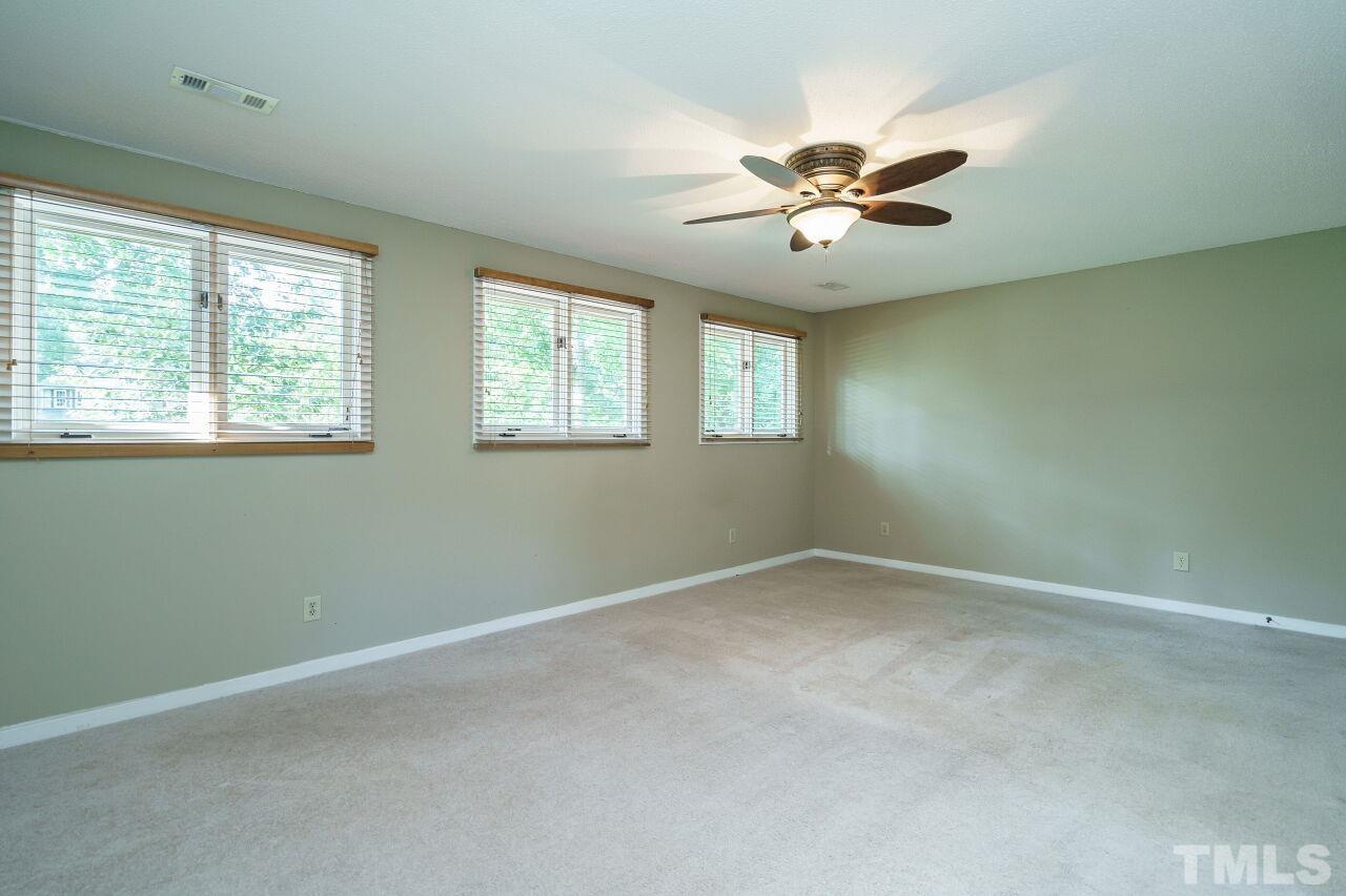 12213 Galway Drive Raleigh, NC 27613 - Photo 20 of 31 a view of an empty room with a window