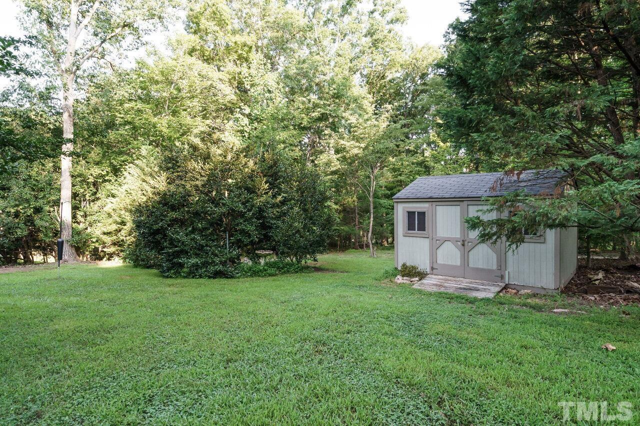 12213 Galway Drive Raleigh, NC 27613 - Photo 29 of 31 a view of a house with backyard and garden