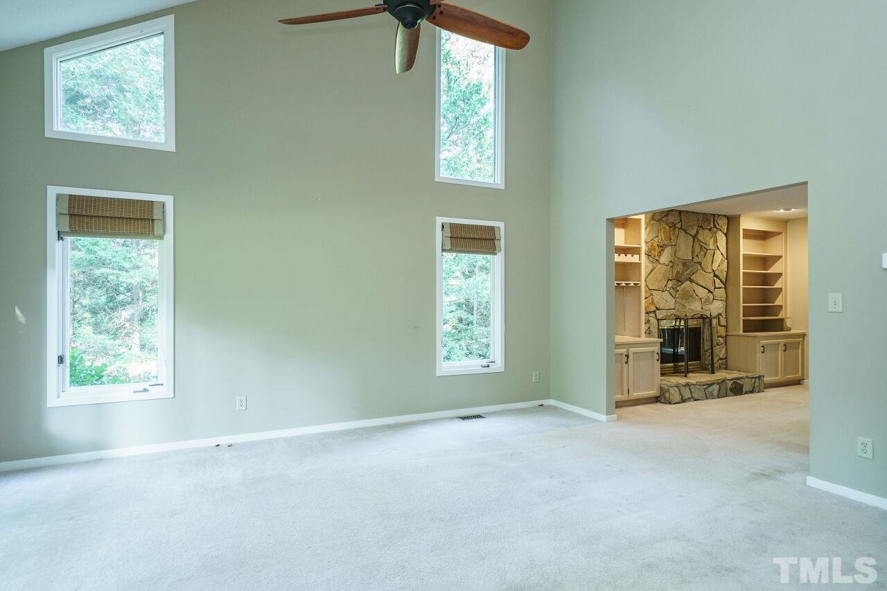 12213 Galway Drive Raleigh, NC 27613 - Photo 4 of 31 an empty room with windows