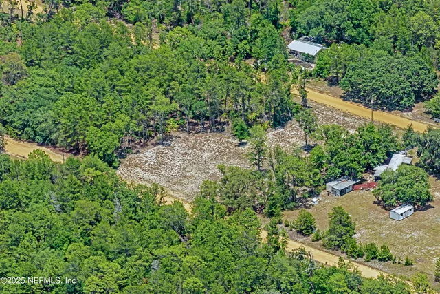 an aerial view of residential house with outdoor space