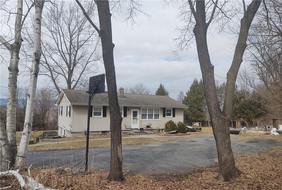 46 Malloy Road Wallkill, NY 12589 - Photo 1 of 1 a front view of a house with trees covered with snow