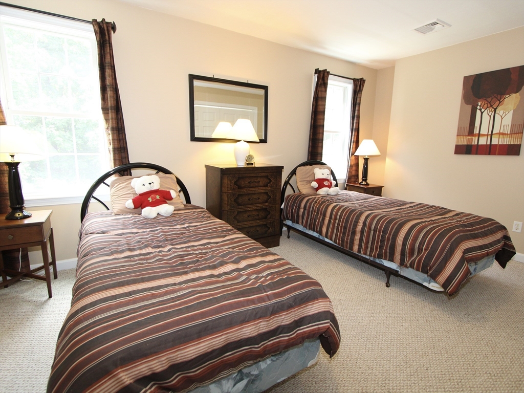 159 Mower Street Worcester, MA 01602 - Photo 11 of 27 a bedroom with two beds and a dresser