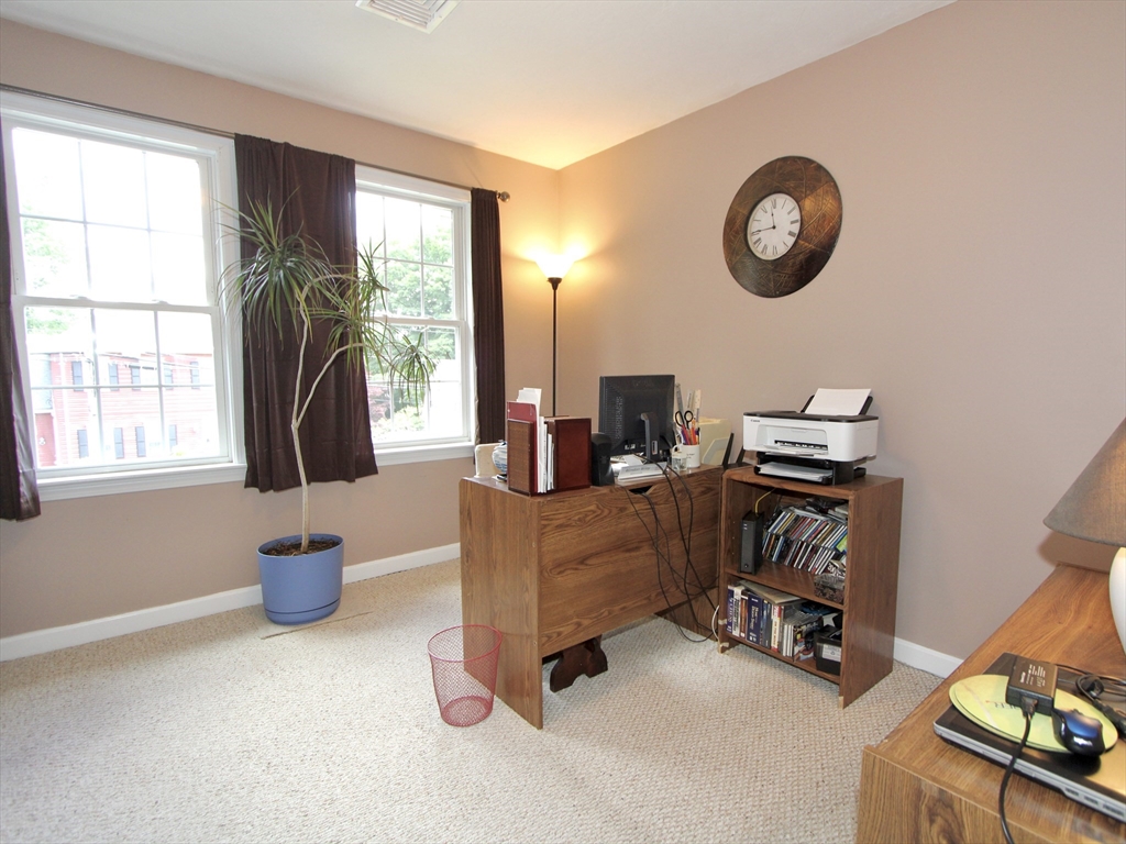 159 Mower Street Worcester, MA 01602 - Photo 12 of 27 a view of a workspace with furniture and a window