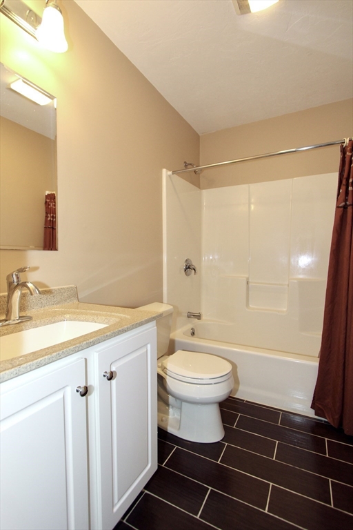 159 Mower Street Worcester, MA 01602 - Photo 13 of 27 a bathroom with a sink toilet a mirror and shower