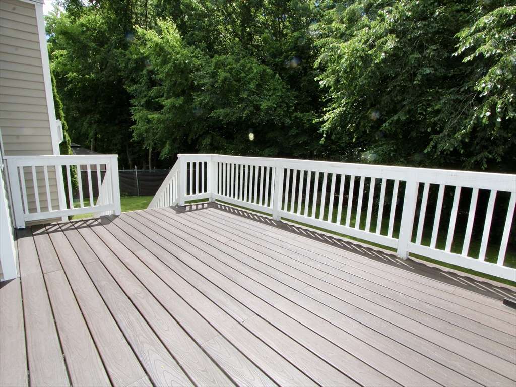 159 Mower Street Worcester, MA 01602 - Photo 24 of 27 a view of balcony with wooden floor and fence