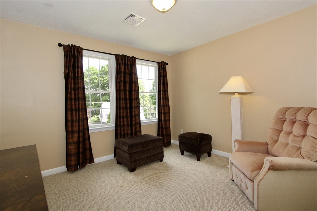 159 Mower Street Worcester, MA 01602 - Photo 10 of 27 a living room with furniture and a lamp
