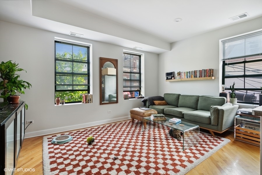 1310 West 18th Street, Unit 2D Chicago, IL 60608 - Photo 2 of 6 a living room with furniture and a window