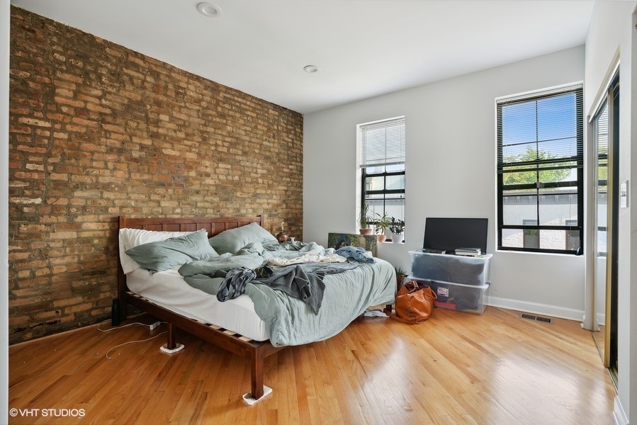 1310 West 18th Street, Unit 2D Chicago, IL 60608 - Photo 4 of 6 a living room with furniture and a wooden floor