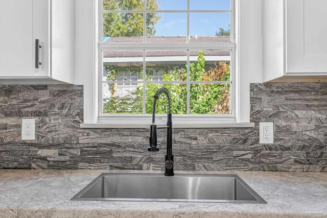 a kitchen with a sink and a window