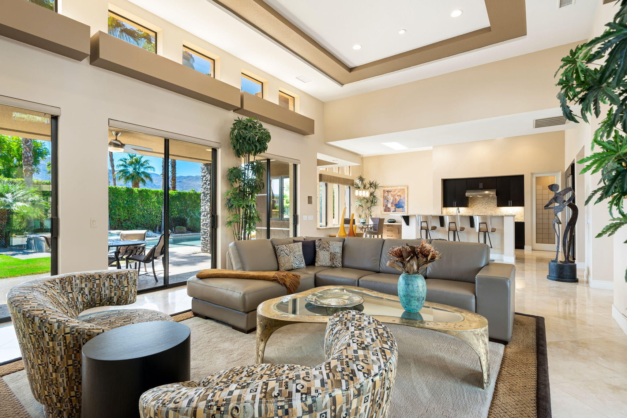 14 Dominion Court Rancho Mirage, CA 92270 - Photo 17 of 65 a living room with fireplace furniture and a large window