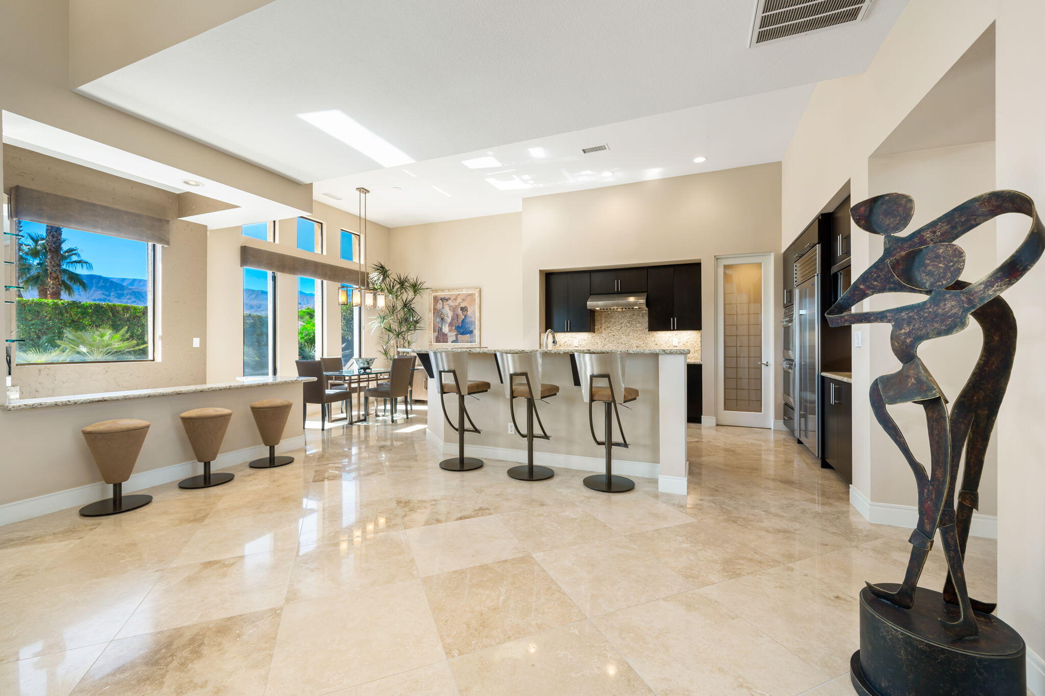 14 Dominion Court Rancho Mirage, CA 92270 - Photo 18 of 65 a living room with furniture and a flat screen tv
