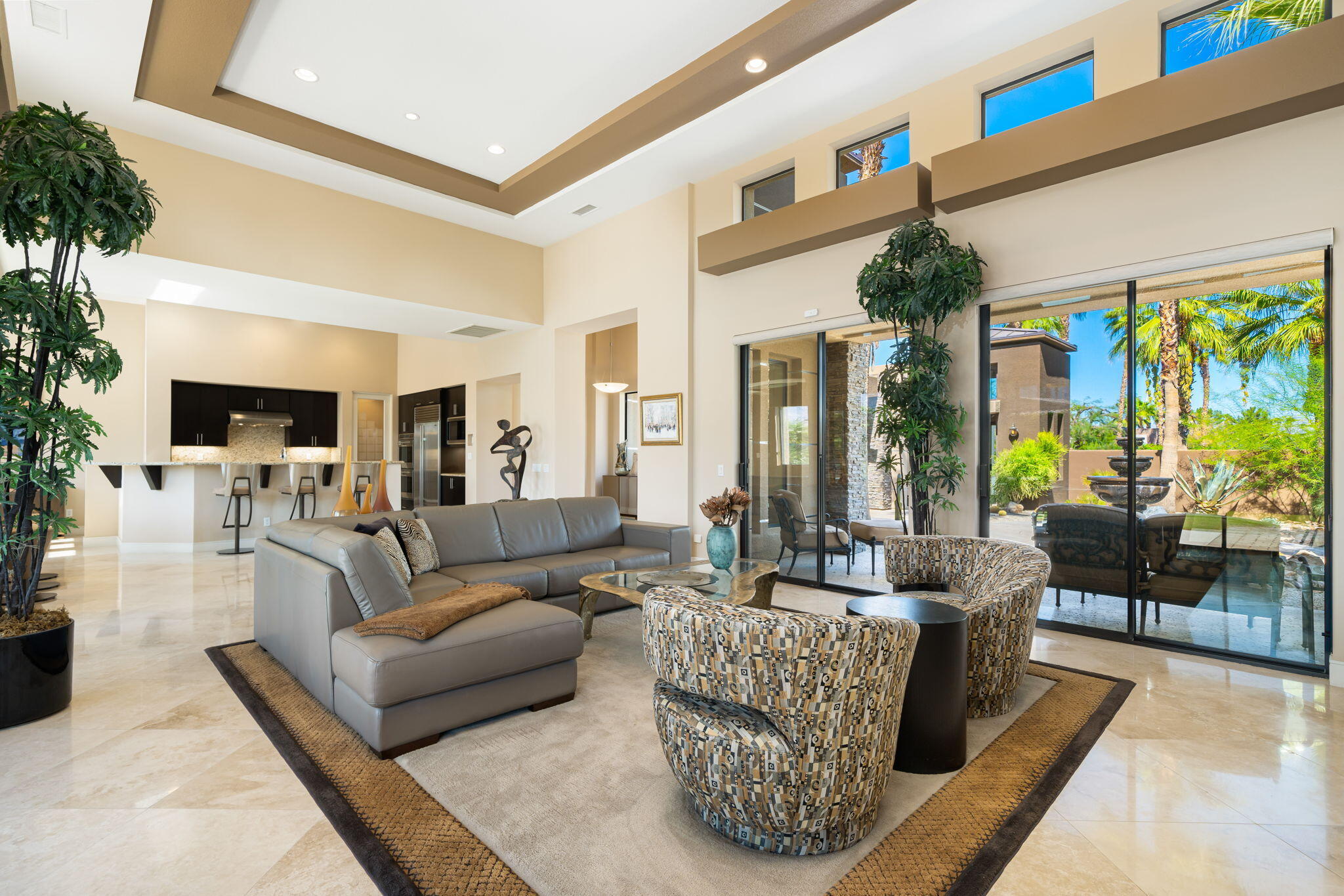 14 Dominion Court Rancho Mirage, CA 92270 - Photo 22 of 65 a living room with furniture and a large window