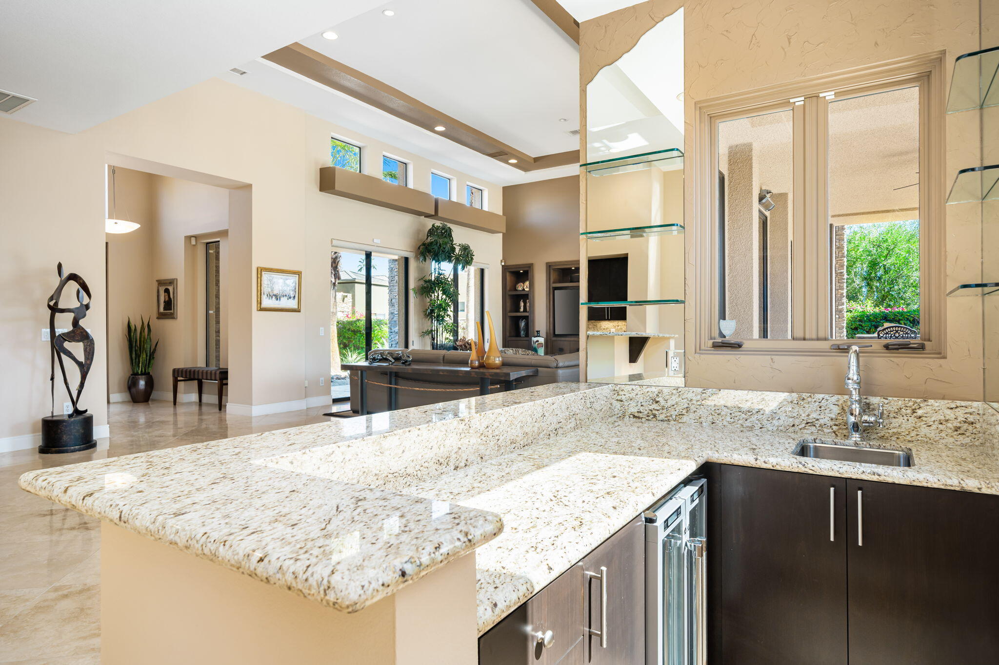 14 Dominion Court Rancho Mirage, CA 92270 - Photo 30 of 65 a bathroom with a granite countertop sink and a large mirror
