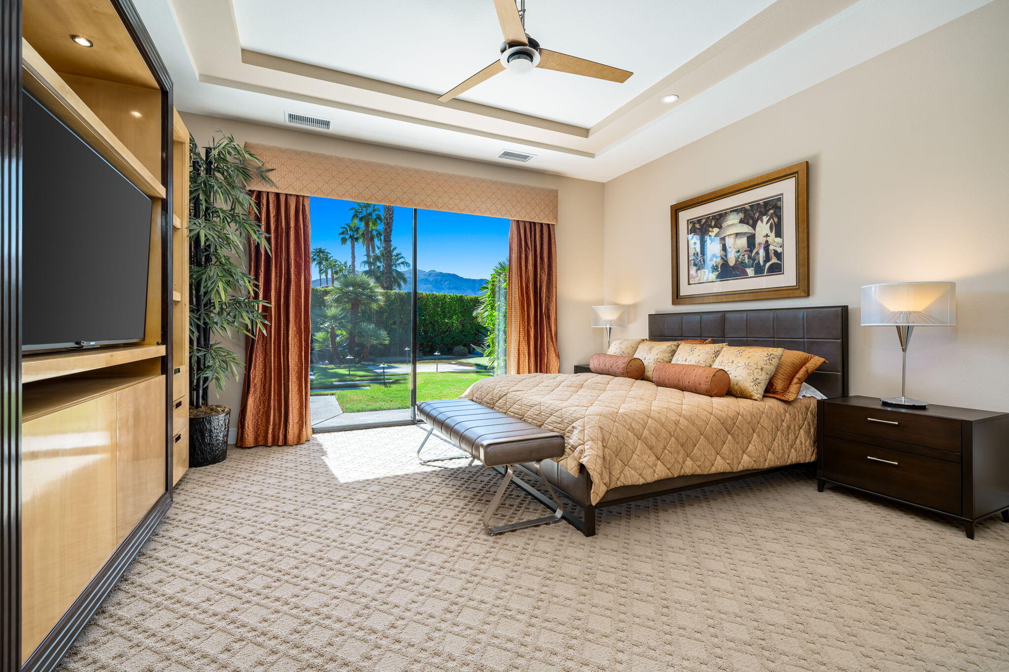 14 Dominion Court Rancho Mirage, CA 92270 - Photo 33 of 65 a bed room with a bed and a television
