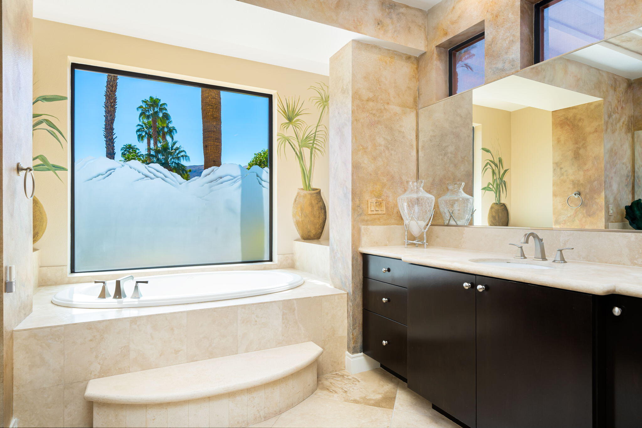 14 Dominion Court Rancho Mirage, CA 92270 - Photo 36 of 65 a bathroom with a granite countertop sink and a mirror