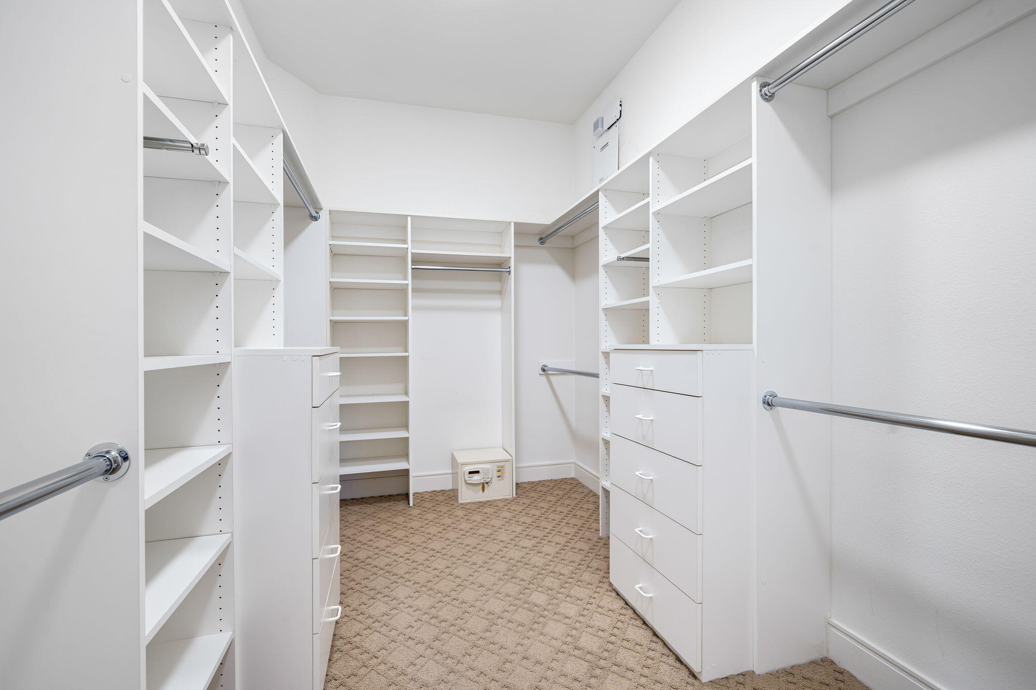 14 Dominion Court Rancho Mirage, CA 92270 - Photo 38 of 65 a view of walk in closet with empty racks