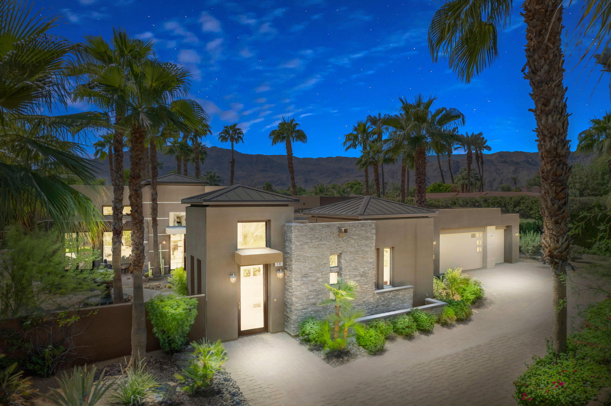 14 Dominion Court Rancho Mirage, CA 92270 - Photo 4 of 65 a front view of a house with garden