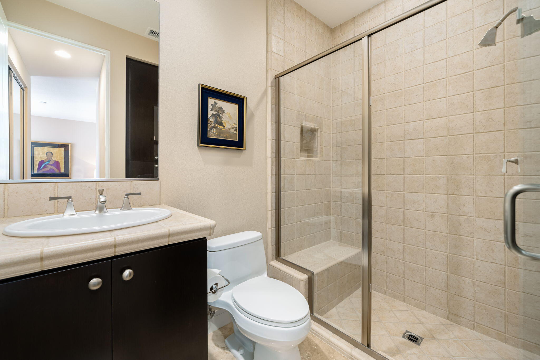 14 Dominion Court Rancho Mirage, CA 92270 - Photo 42 of 65 a bathroom with a toilet a sink a mirror and a shower