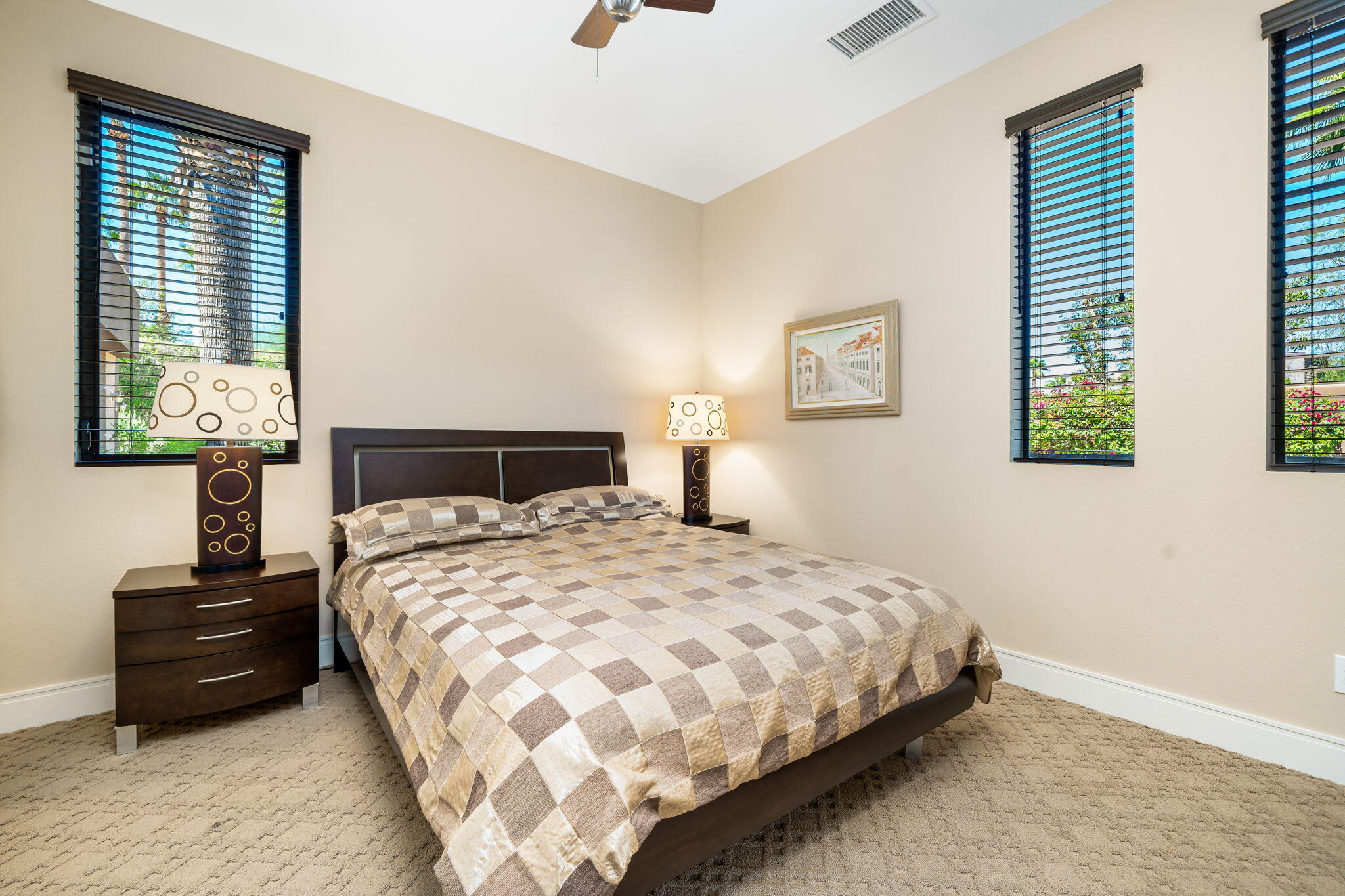14 Dominion Court Rancho Mirage, CA 92270 - Photo 45 of 65 a bedroom with a bed and wooden floor